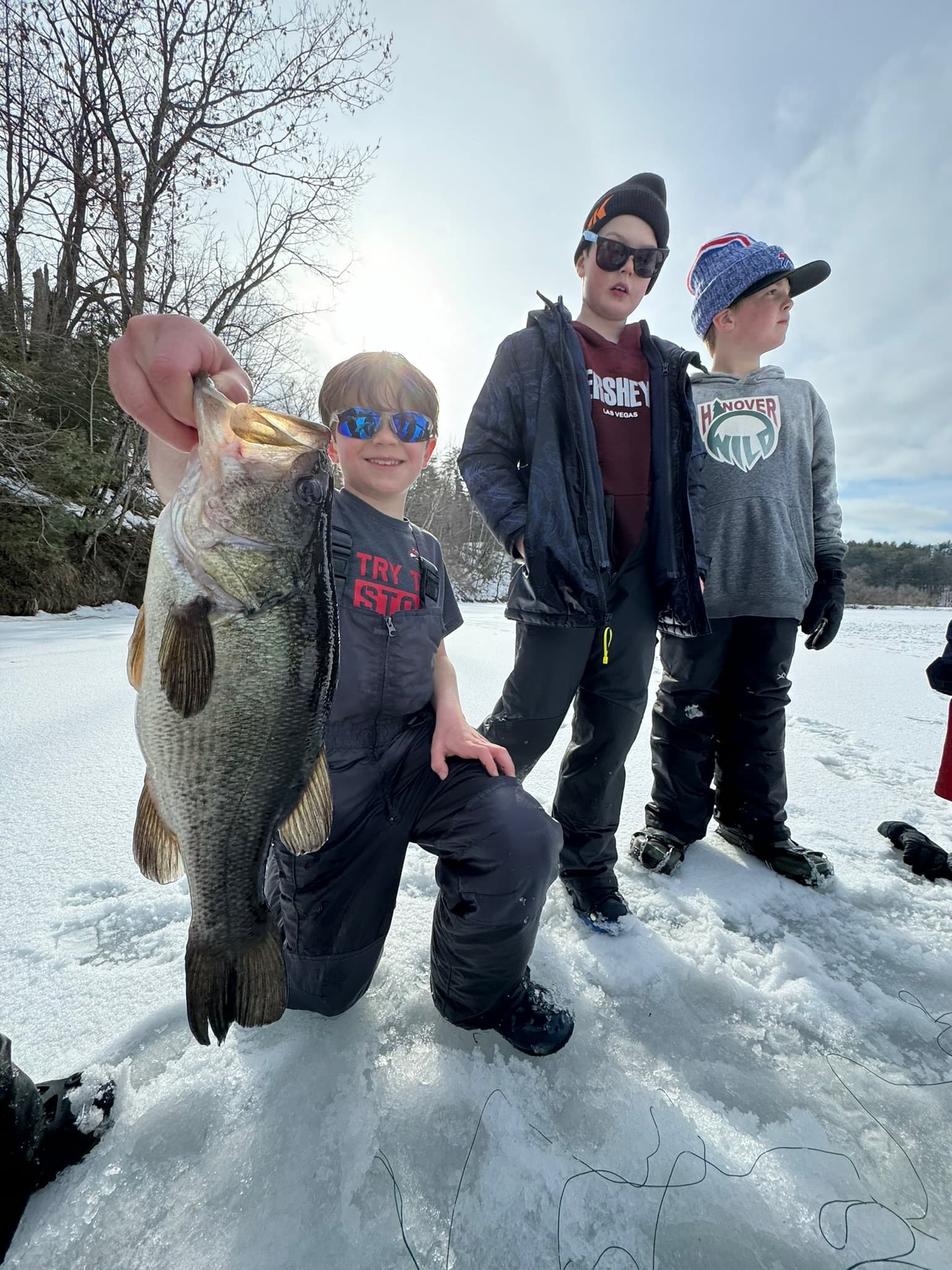 Children learning fishing techniques at summer kids camp